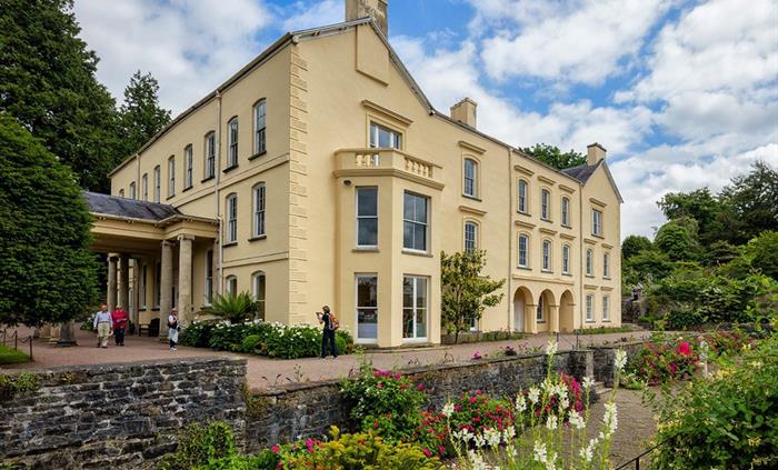 Aberglasney mansion with visitors outside